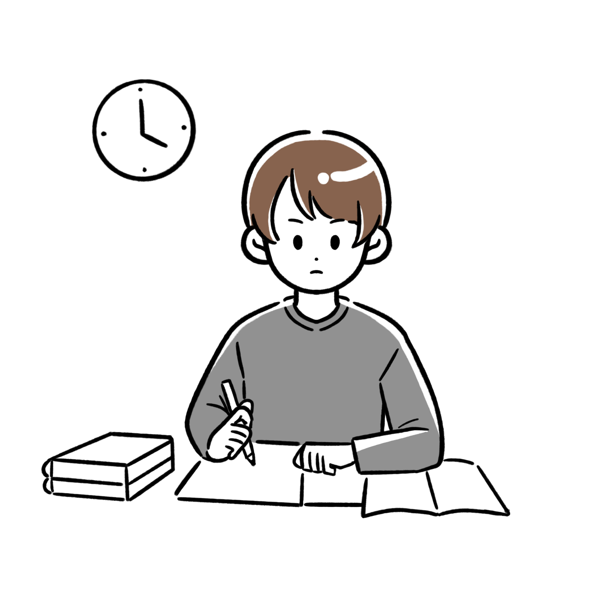 机に向かって真剣に勉強している男の子